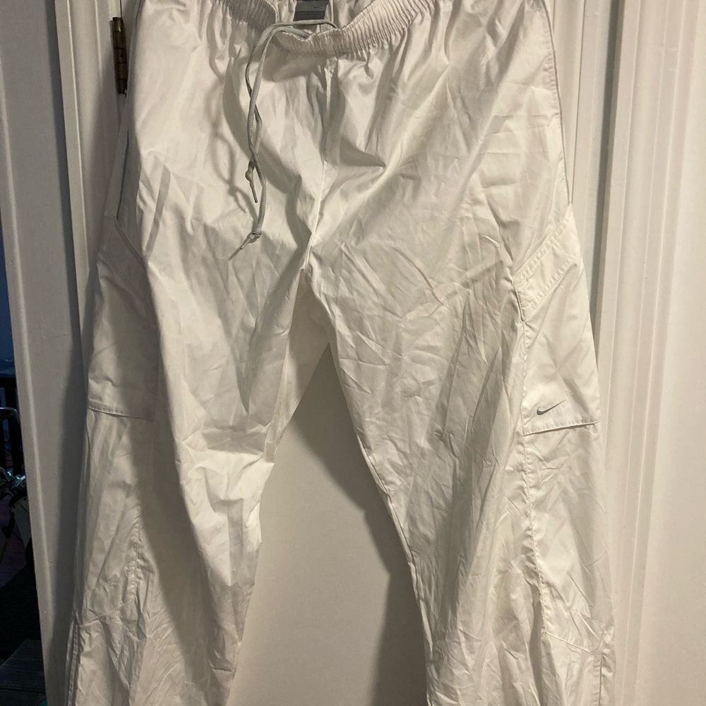Brand New Nike Running/Wind Pants. New with tags never worn. No damage.